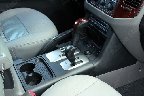 Modern design new Automatic gear knob lever. Gear lever. Automatic Transmission. Hand on the gear shift in a car. Speed transmission and reverse shifting position.