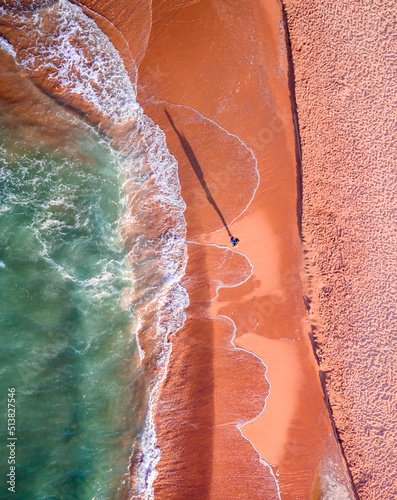 Vista zenital proyectando sombra sobre arena. Imagen tomada con drone.  photo