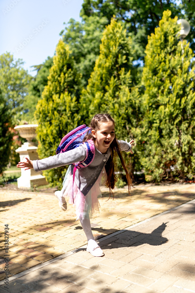 Back to school. Cute child girl with backpack running and going to school with fun Back to school. Cute child girl with backpack running and going to school with fun