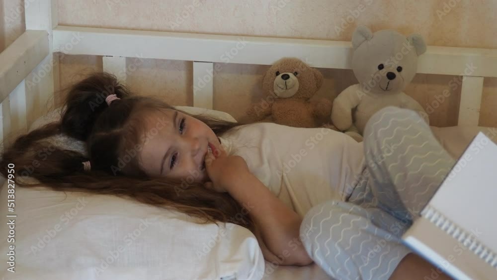 Before go to night or daytime sleep mother reading to daughter fairytale, kid enjoy storytelling lying with mommy in bed feels comfortable, good pastime develop reader skill, have fun at home concept Before go to night or daytime sleep mother reading to daughter fairytale, kid enjoy storytelling lying with mommy in bed feels comfortable, good pastime develop reader skill, have fun at home concept