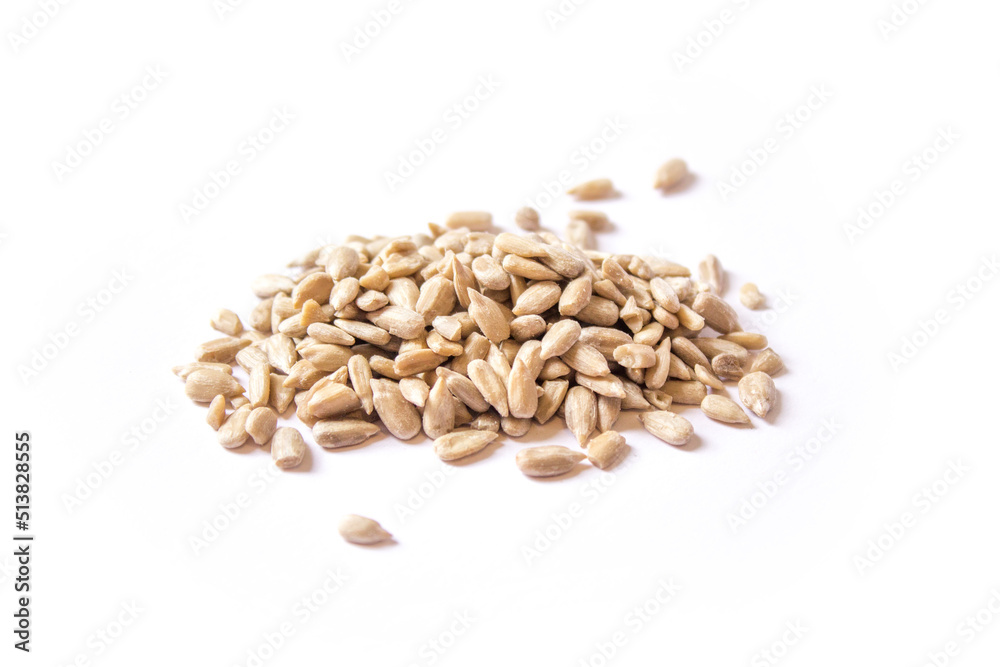 sunflower seeds lie on a white background sunflower seeds lie on a white background