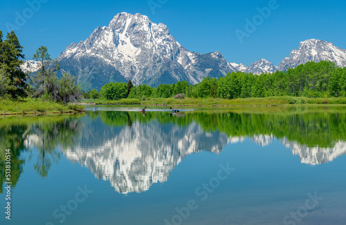 Tetons reflecting on a lake and wilderness. © RG