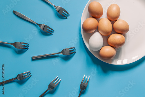 Eggs and forks, flat lay, oocyte fertilization, pregnancy, conception concept.
