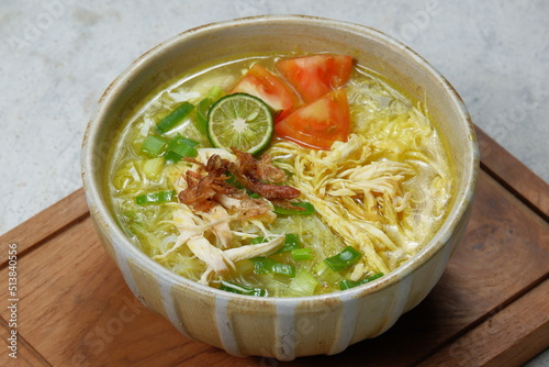Soto ayam is a typical indonesian food in the form of a kind of chicken soup with a yellowish sauce 