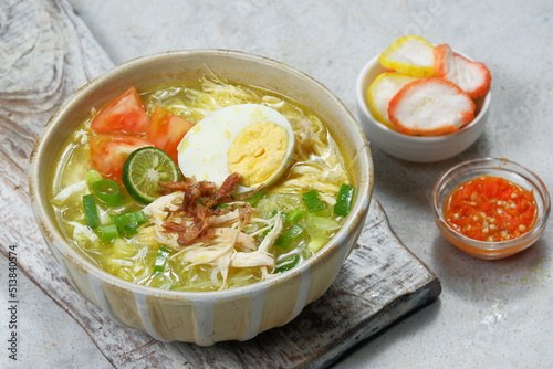 Soto ayam is a typical indonesian food in the form of a kind of chicken soup with a yellowish sauce  photo