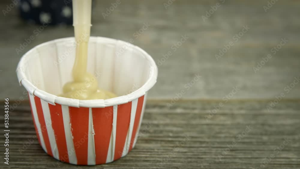 Filling Cup with Mustard Filling Cup with Mustard