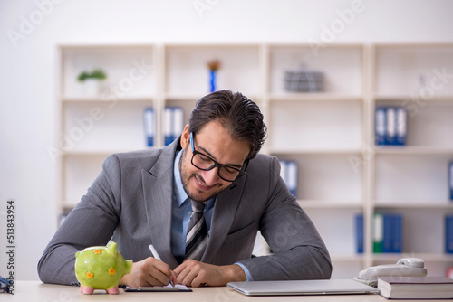 Young male employee in planning retirement concept