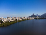 Aerial view of Rodrigo de Freitas Lagoon, south zone of Rio de Janeiro, Brazil. In the background, the beaches of Ipanema and Leblon and Morro Dois Irmãos. Sunny day. Buildings around. Drone photo