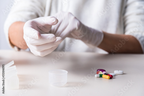 latex gloves with color pills, health concept