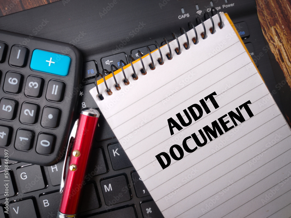 Calculator,pen and wireless keyboard with the word AUDIT DOCUMENT. Calculator,pen and wireless keyboard with the word AUDIT DOCUMENT.