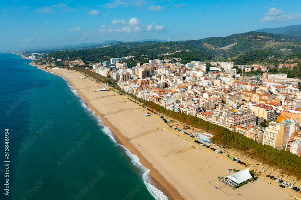 Townscape of Calella, Maresme region, Spain. View of sea coast and beach.