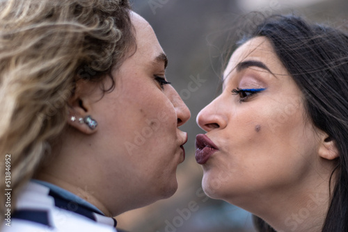 portrait of lesbian couple about to kiss