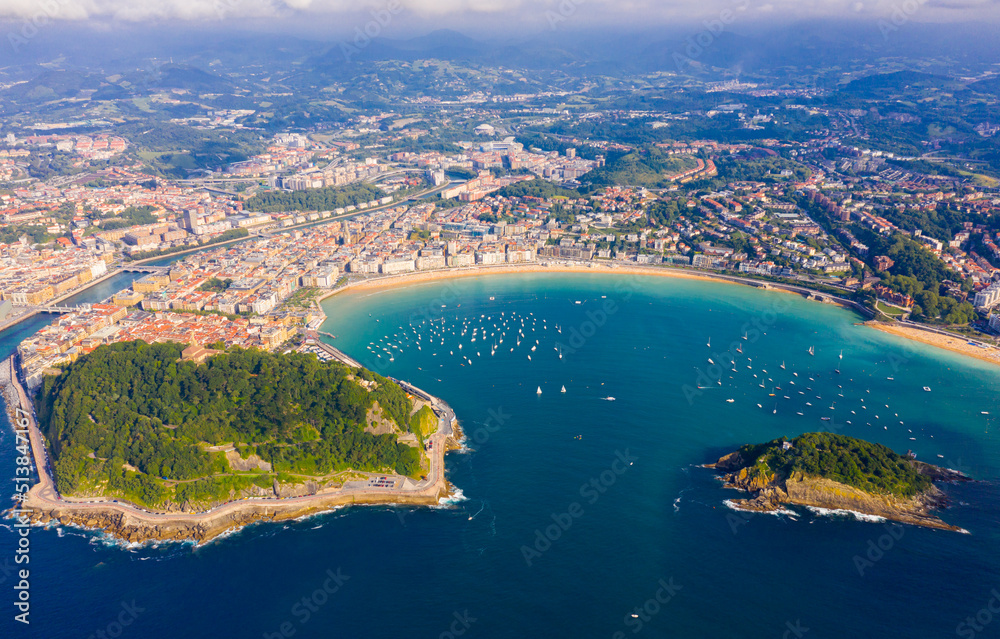 Aerial panoramic view of summer seascape with La Concha Bay and coastal city of San Sebastian, Basque Country, Spain..