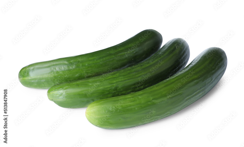 Whole fresh green cucumbers isolated on white Whole fresh green cucumbers isolated on white