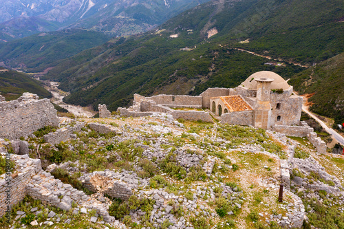 Picturesque view of ruins of antique castle of Borsh with Hajji Bendo Mosque, Albania photo