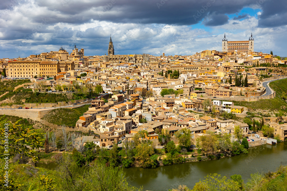 Cityscape of Toledo view of Alcazar and Tagus River. Castilla-La Mancha, Spain.