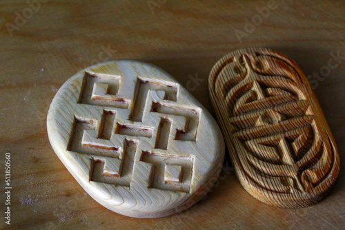 Wooden block with ornate traditional carvings for baking boov biscuits photo