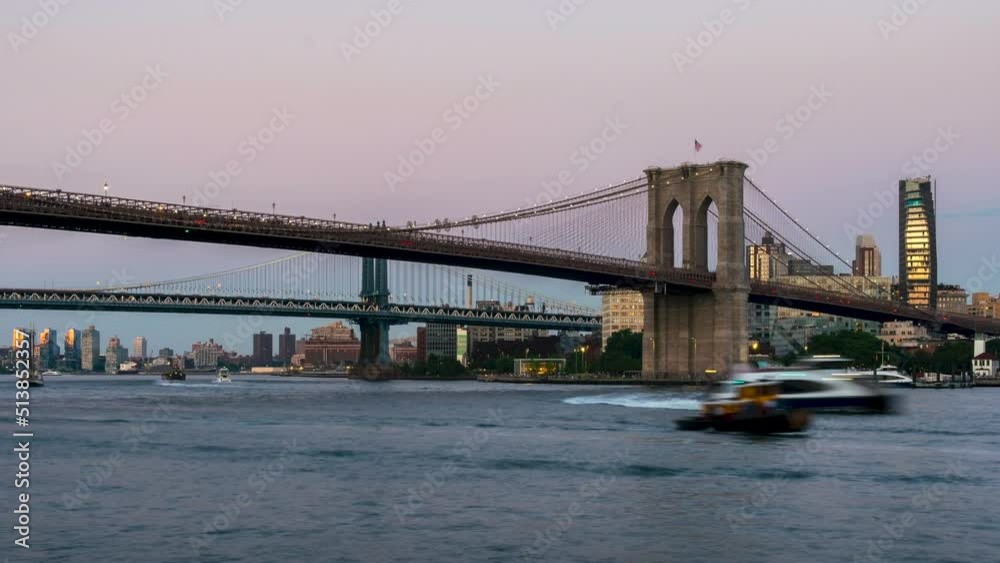 Late Evening Time Lapse Of the Brooklynn Bridge With Boats on the Water Late Evening Time Lapse Of the Brooklynn Bridge With Boats on the Water
