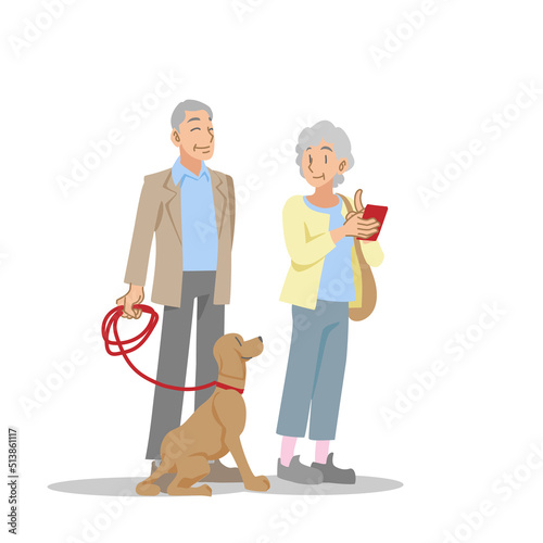 犬と散歩を楽しむ老夫婦