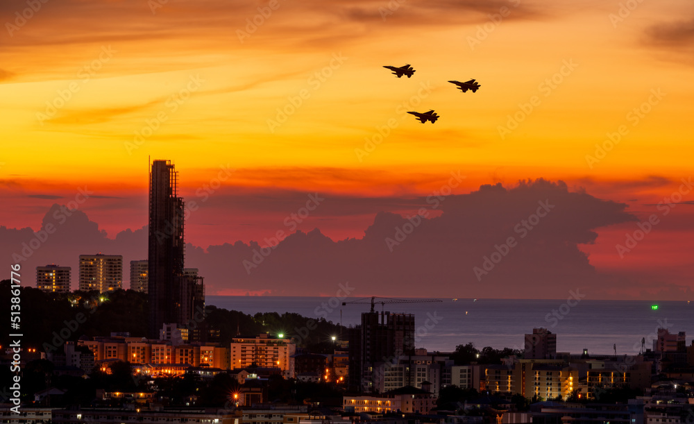 Fototapeta premium Silhouette airplane with beautiful colorful sunset sky background. 