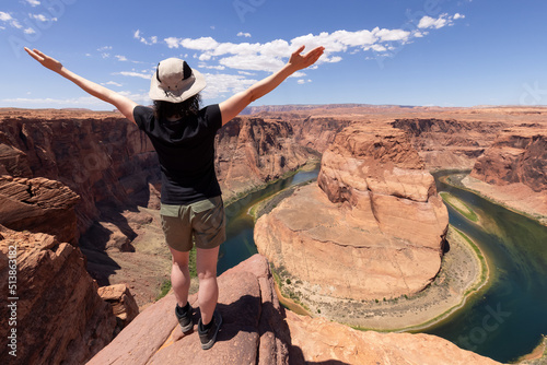 Adventurous Caucasian Woman at Horseshoe Bend in Page, Arizona, United States. Famous Iconic American Nature Landscape. Adventure Travel