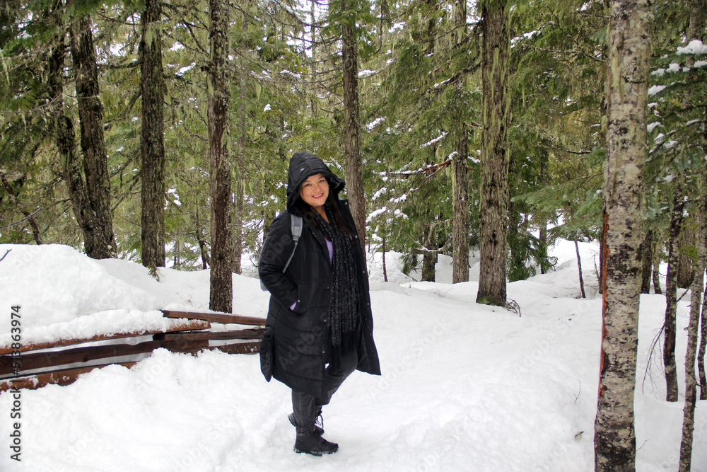 Latin adult woman with black jacket and gray backpack hiking in the snowy mountain very happy, free, full, positive, enjoys life and sports
Latin adult woman with black jacket and gray backpack hiking in the snowy mountain very happy, free, full, positive, enjoys life and sports