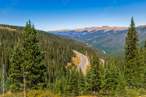 View of mountain road through Rocky Mountain National Park, Colorado, USA, from continental divide at Berthoud Pass in autumn