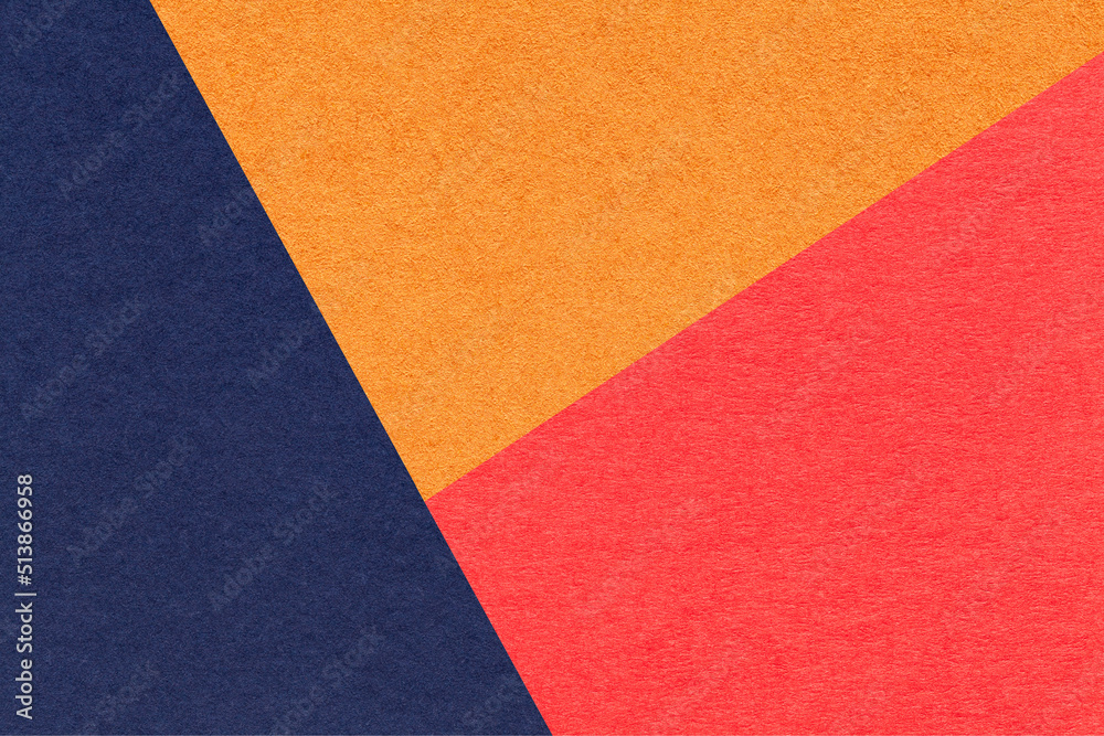 Texture of craft navy blue, orange and red shade color paper background, macro. Structure of vintage abstract cardboard Texture of craft navy blue, orange and red shade color paper background, macro. Structure of vintage abstract cardboard
