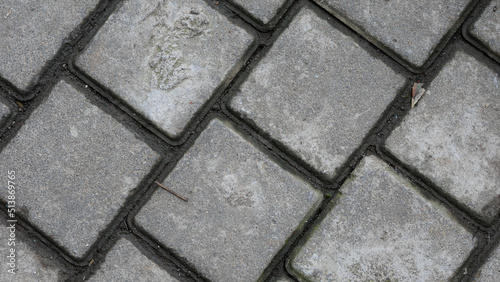 paving stones texture. facing gray tiles as a vintage background