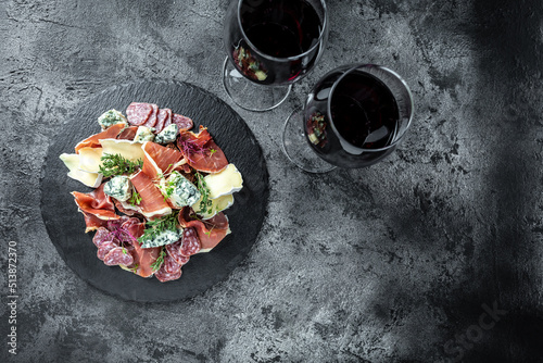 Appetizers. prosciutto and blue cheese. antipasti with red wine. banner, menu recipe place for text, top view