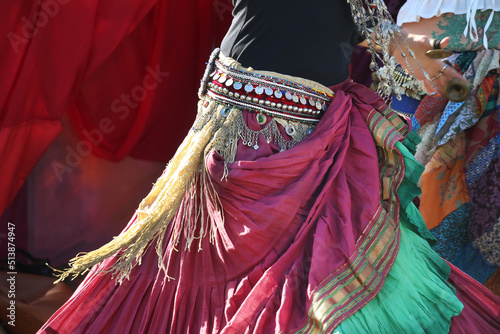 Fotografia Elements of clothing for a gypsy dance, a scarf at the waist, a belt with a moni