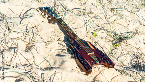 Ukulele on the sand. © gshakwon