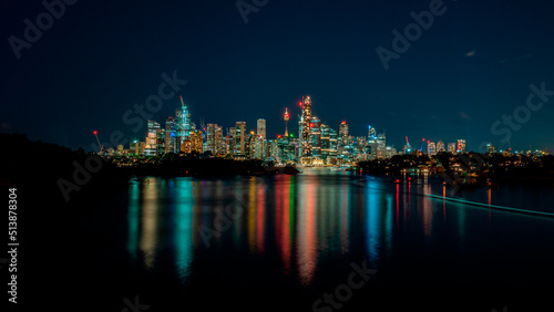 Wide and colorful view of Sydney cityscape at night. © gshakwon