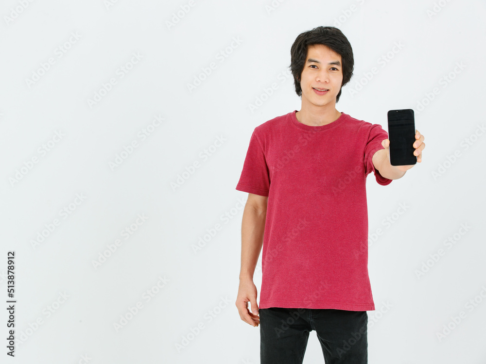 Portrait isolated cutout studio shot Asian young handsome teen male model in street style outfit standing smiling holding pointing finger presenting black blank screen smartphone on white background Portrait isolated cutout studio shot Asian young handsome teen male model in street style outfit standing smiling holding pointing finger presenting black blank screen smartphone on white background