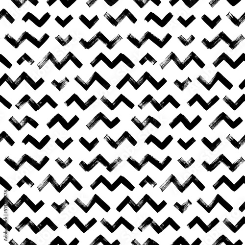 Zigzag chevron grunge black seamless pattern. Short zig zag horizontal stripes. Hand drawn vector geometric brush strokes. Black painted grunge texture. Repeated chevron lines background photo