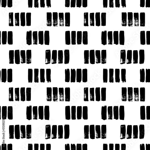 Short hand drawn strokes vector seamless pattern. Vertical black brush strokes in a row. Monochrome grunge texture in hipster style. Black paint dry brushstrokes. Short vertical lines or dashes