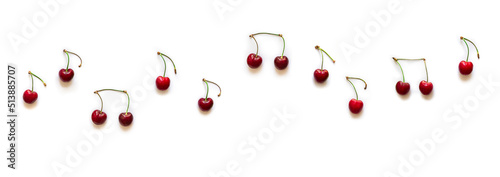 on white background notes from berries sweet cherry red color place inscription music notation camp copy space banner