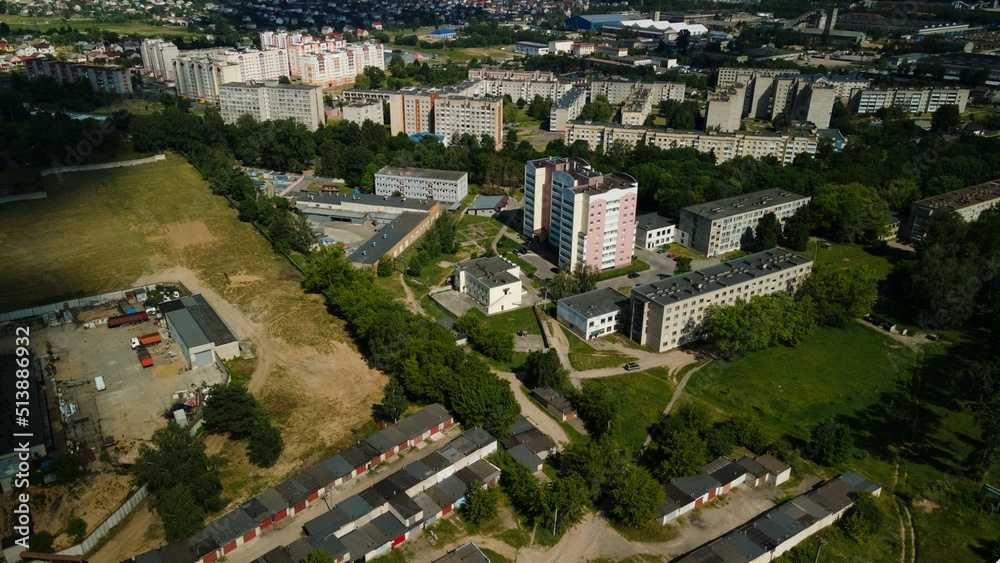 Tranquil suburbs in a big city. Multi-storey buildings and a large green area. Panoramic photo. Aerial photography.