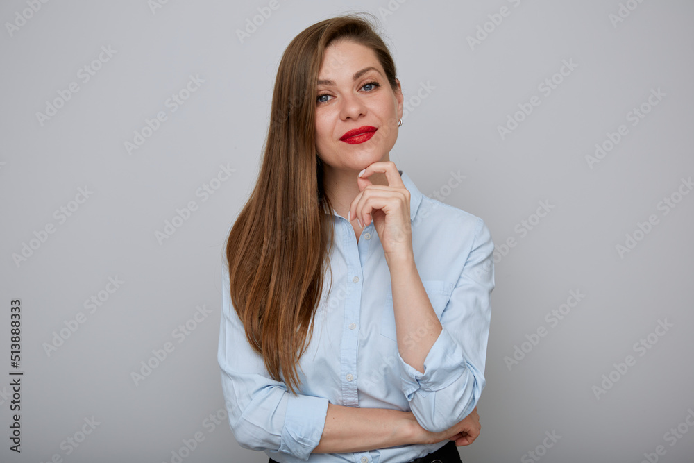 Smiling business woman thinking and touching her face, isolated portrait Smiling business woman thinking and touching her face, isolated portrait