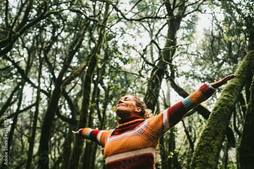 Freedom and happiness lifestyle and moment. Standing middle age young woman open arms and smile. Success life and nature feeling. Outdoors nature lover. Protect woods and sustainabiliy future photo