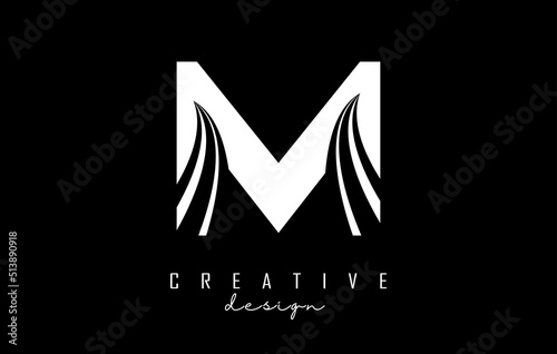 White letter M logo with leading lines and road concept design. Letter M with geometric design.