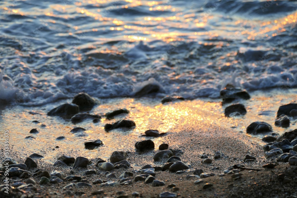 Sand and sea on the beach in sunset Sand and sea on the beach in sunset