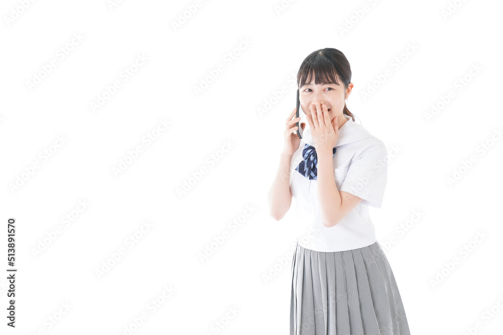Uniformed young student using a smartphone Uniformed young student using a smartphone