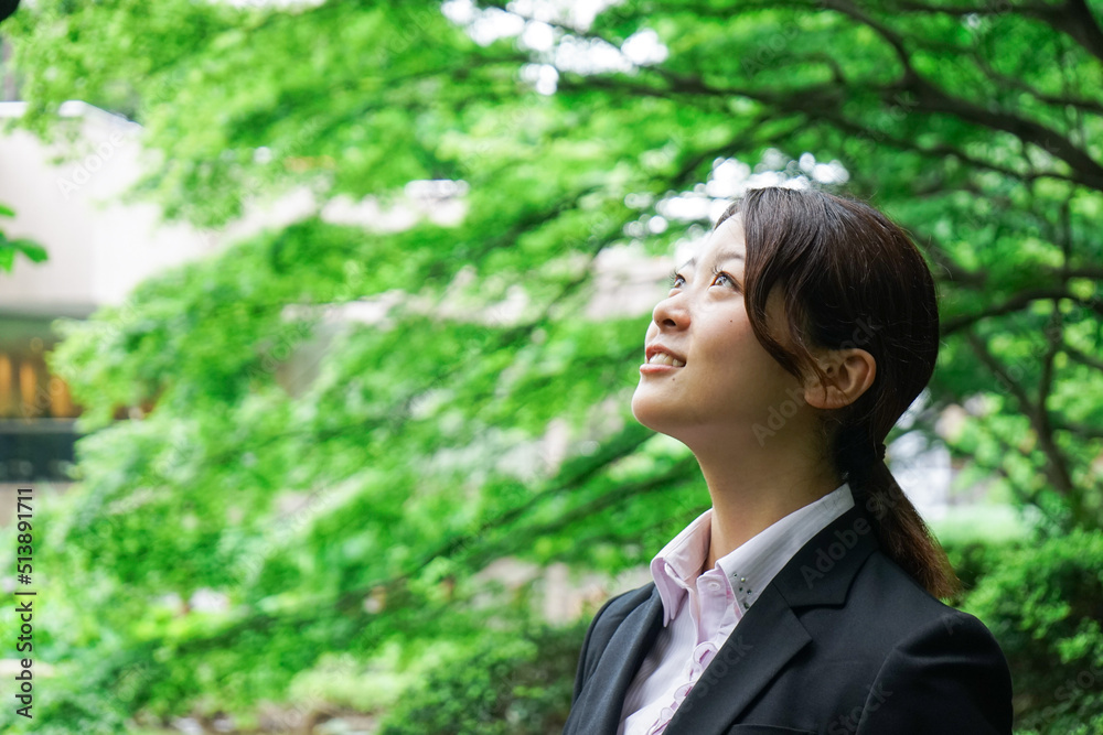 Businesswoman walking outdoors with smile Businesswoman walking outdoors with smile