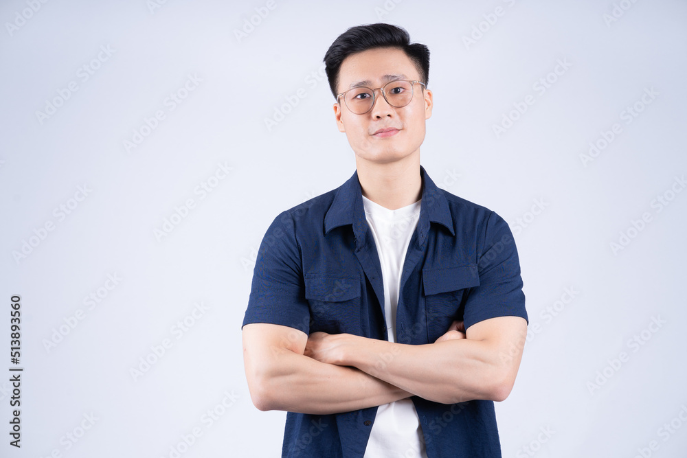 Image of young Asian man posing on white backround Image of young Asian man posing on white backround