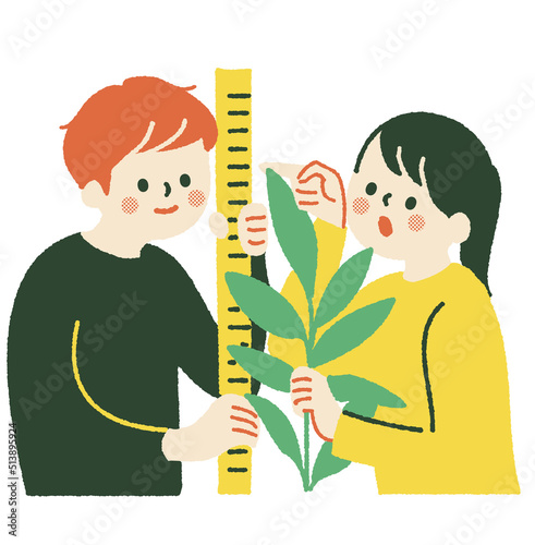 樹高計測を行う男子児童と女子児童