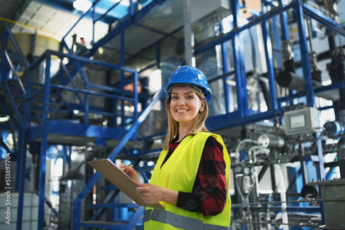 Billede på lærred Portrait of female engineer working in industrial factory, doing checkup control