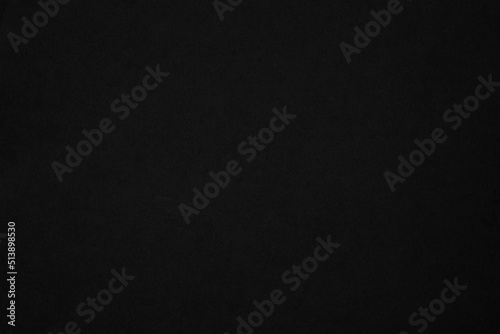 Black paper texture background. Black blank cardboard sheet page. Old vintage page dark grunge vignette.