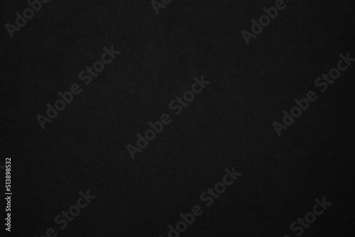 Black paper texture background. Black blank cardboard sheet page. Old vintage page dark grunge vignette.
