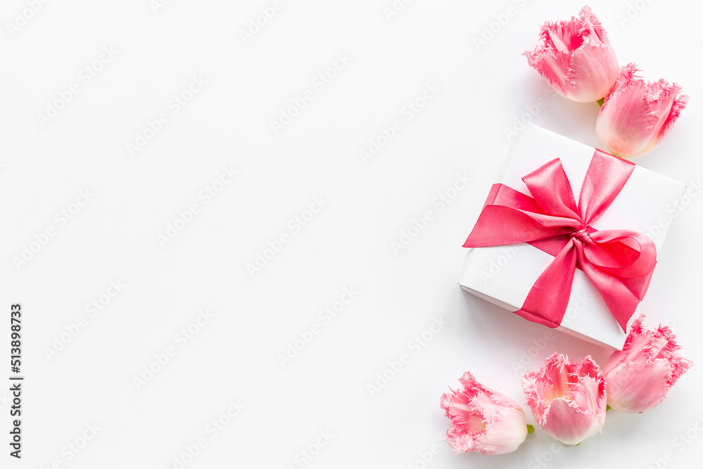 Happy Mothers day. Pink flowers with white gift box Happy Mothers day. Pink flowers with white gift box